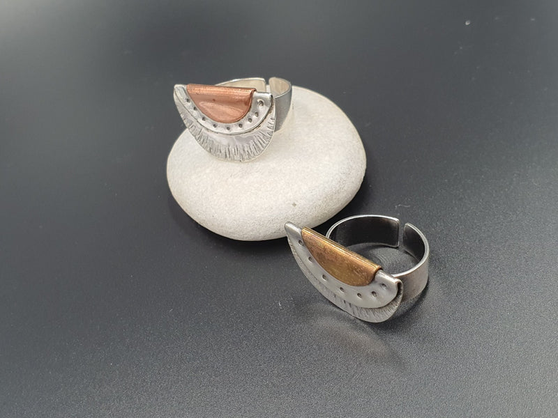 Handworked oxidized sterling silver fan rings, with copper and brass accents