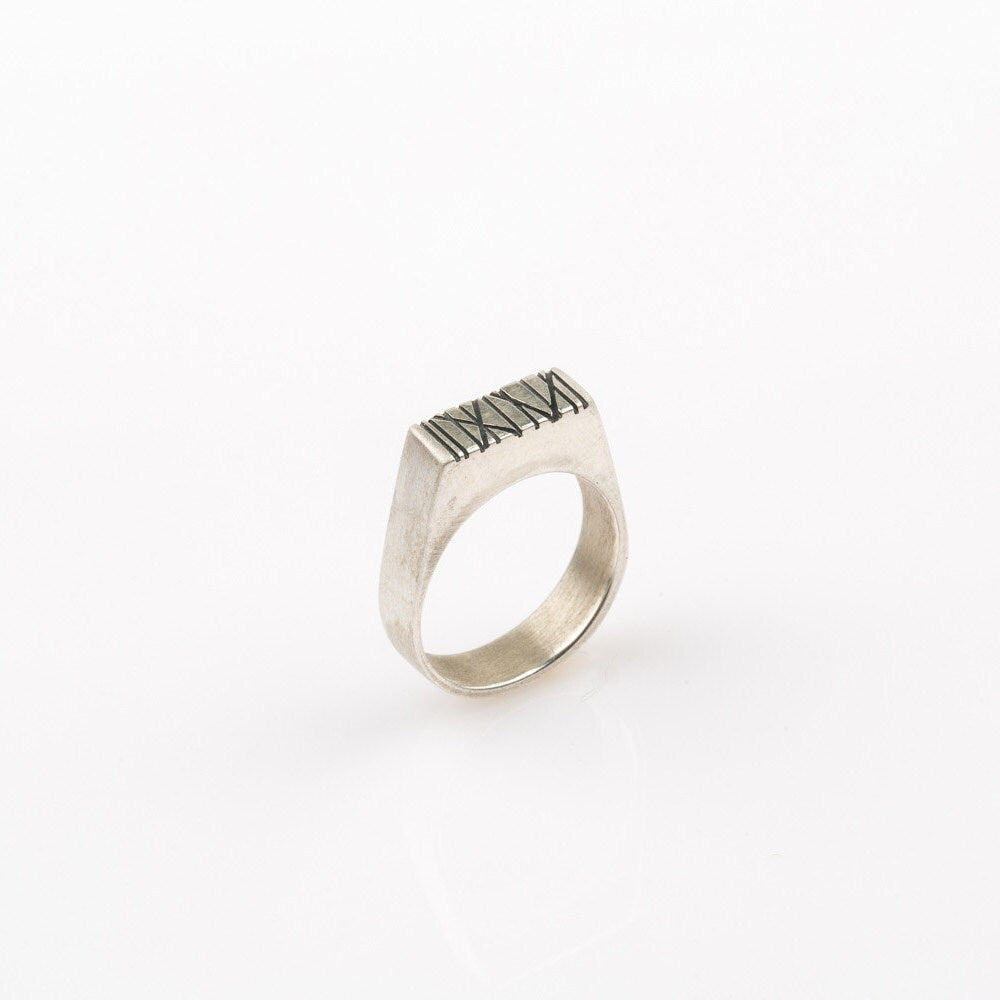Silver rectangle signet ring with random Engraved lines