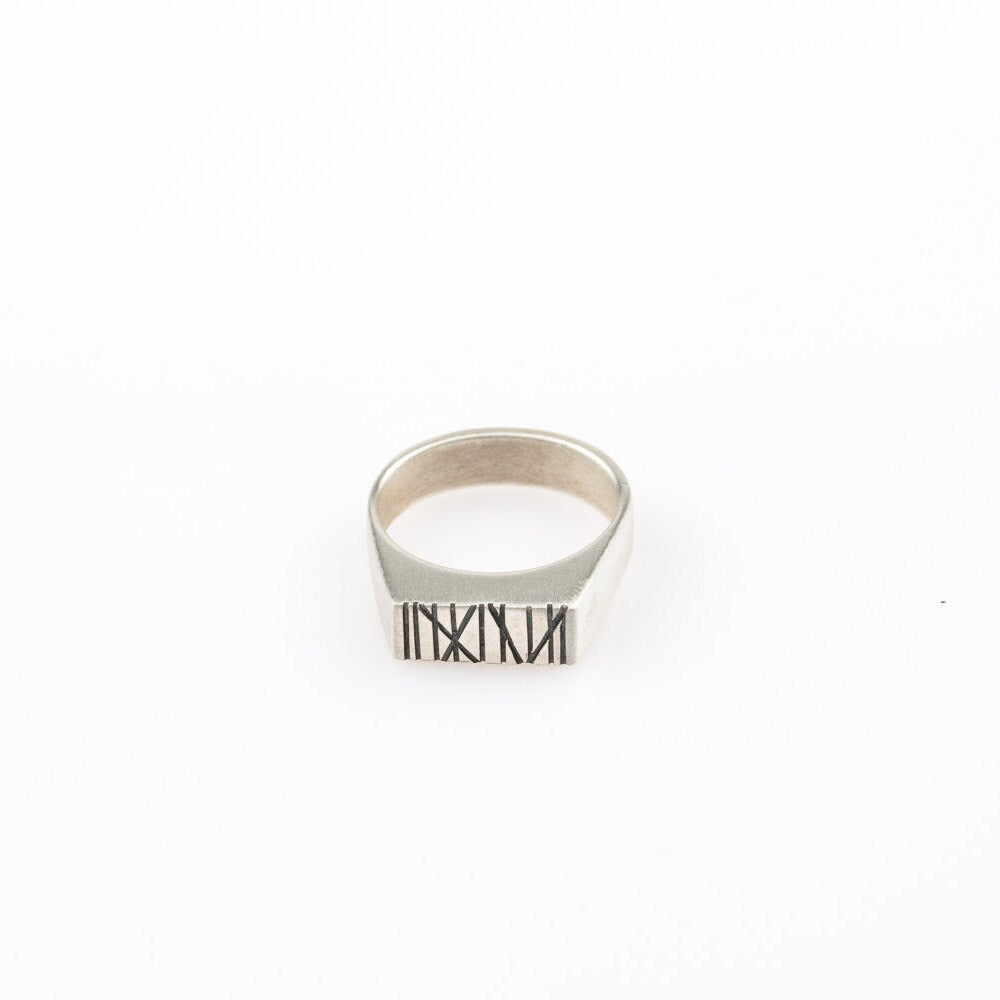 Silver rectangle signet ring with random Engraved lines