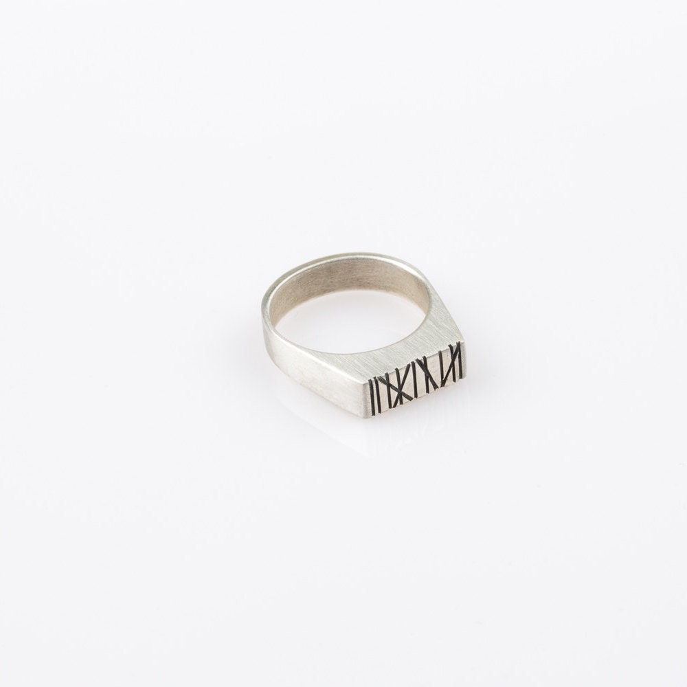 Silver rectangle signet ring with random Engraved lines