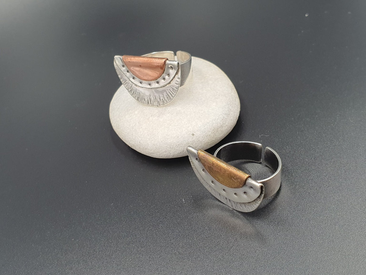 Handworked oxidized sterling silver fan rings, with copper and brass accents